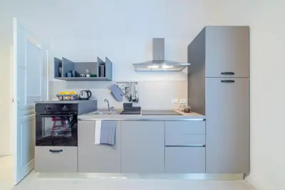 Cucina o angolo cottura di GuestHost - Ortigia and Temple of Apollo Apartments