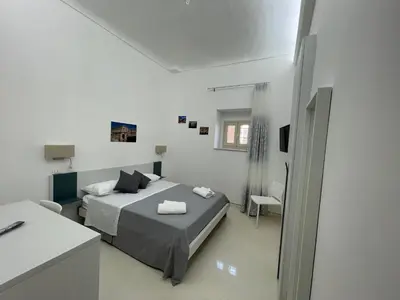 Letto o letti in una camera di Casa Crispi