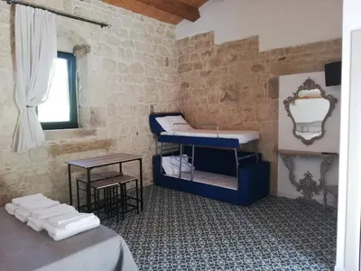 Letto o letti in una camera di Agriturismo Fondo Paliemmu