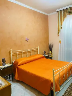 Letto o letti in una camera di Giusy's House