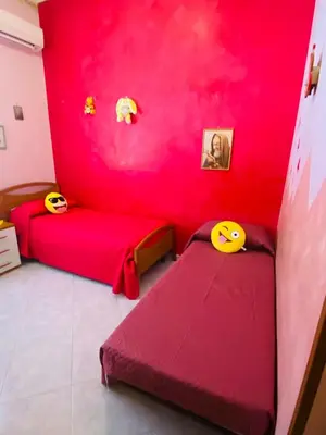 Letto o letti in una camera di Giusy's House