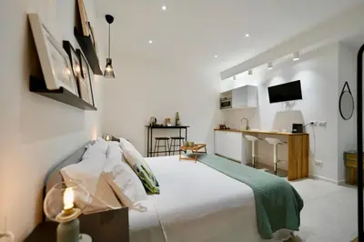 Letto o letti in una camera di CASABELLA Apartments Antico mercato Ortigia Siracusa