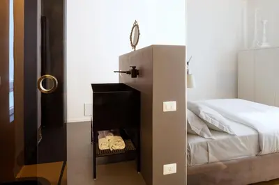 Letto o letti in una camera di Ortigia Riflessa - design e comfort vista mare