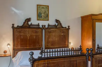 Letto o letti in una camera di Masseria Fortificata Lo Zafferaneto