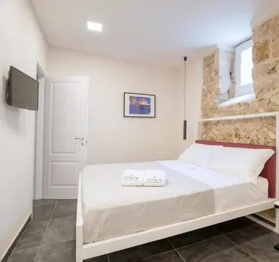 Letto o letti in una camera di MYMOON Neas