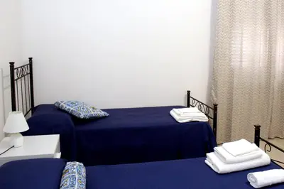 Letto o letti in una camera di B&B Ciccannina