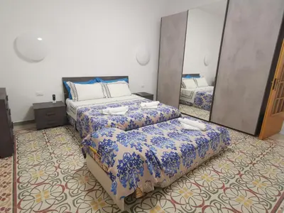 Letto o letti in una camera di Casa Ariete
