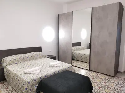Letto o letti in una camera di Casa Ariete