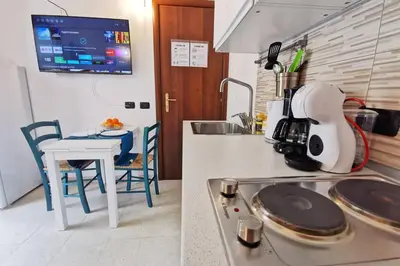 Cucina o angolo cottura di Loft Palm Beach - 100 metri dalla spiaggia di sabbia bianca e dal mare