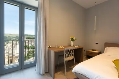 Letto o letti in una camera di Vicolo QuattroSei