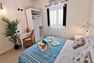 Letto o letti in una camera di Loft Cocorito - 100 metri dalla spiaggia di sabbia bianca e dal mare