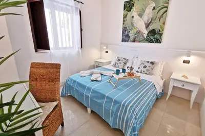 Letto o letti in una camera di Loft Cocorito - 100 metri dalla spiaggia di sabbia bianca e dal mare