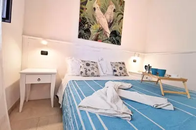 Letto o letti in una camera di Loft Cocorito - 100 metri dalla spiaggia di sabbia bianca e dal mare