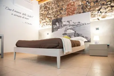 Letto o letti in una camera di B&B Vicolo IV