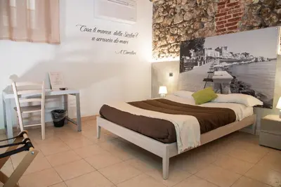 Letto o letti in una camera di B&B Vicolo IV