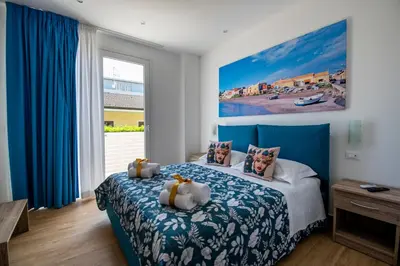 Letto o letti in una camera di White Apartments & Spa