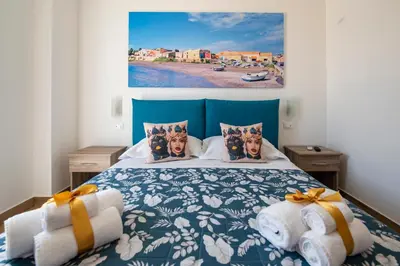 Letto o letti in una camera di White Apartments & Spa