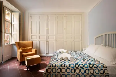 Letto o letti in una camera di I Tre Balconi di Via Roma Apartment