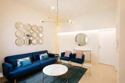 Area soggiorno di Amate Case by Ortigia Apartments