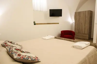 Letto o letti in una camera di Domus Ursino