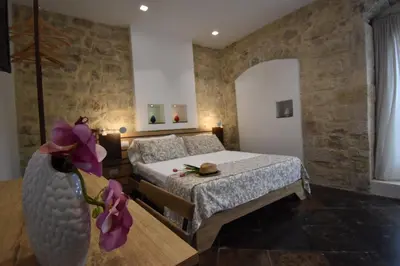 Letto o letti in una camera di B&B Cuore Barocco