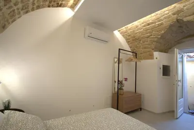 Letto o letti in una camera di B&B Cuore Barocco