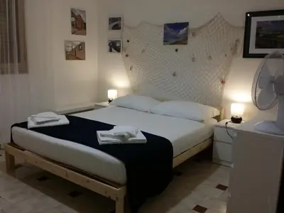 Letto o letti in una camera di Relax e mare Pachino (Costa dell'Ambra) Marzamemi