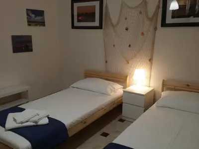 Letto o letti in una camera di Relax e mare Pachino (Costa dell'Ambra) Marzamemi