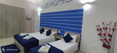 Letto o letti in una camera di Casa Mediterranea
