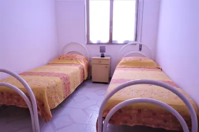 Letto o letti in una camera di Case Arcobaleno Marzamemi