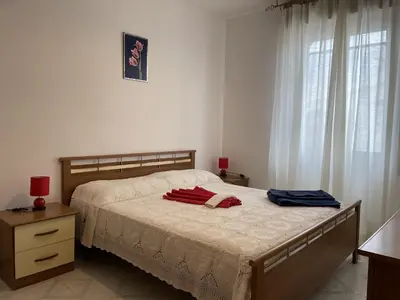 Letto o letti in una camera di Case Arcobaleno Marzamemi