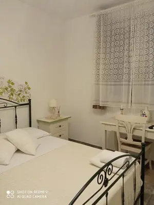 Letto o letti in una camera di Bàcula Nzícula Marzamemi