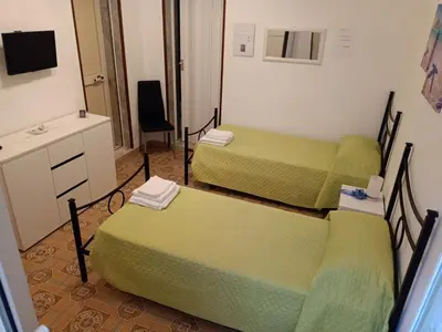 Letto o letti in una camera di B&B Epicarmo