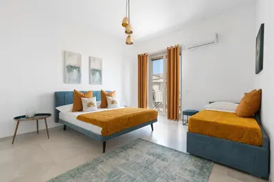 Letto o letti in una camera di Ortigia Boutique Plaza Apt