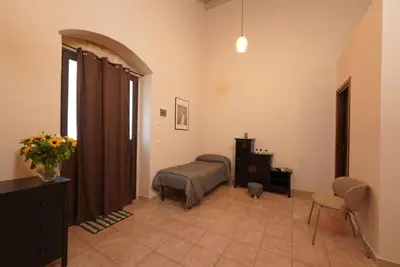 Letto o letti in una camera di Antica Dimora Siracusa