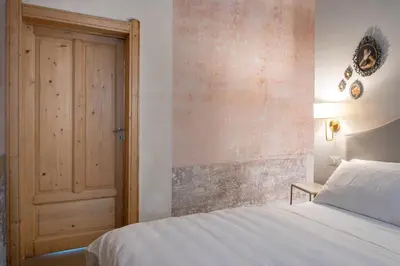 Letto o letti in una camera di Boudoir degli Orti, Unconventional Stay in Borgata, Siracusa