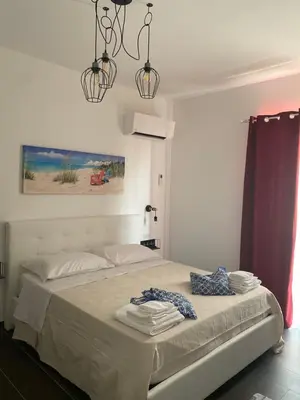 Letto o letti in una camera di B&B Libertà