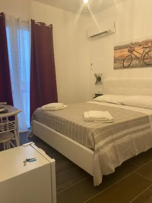 Letto o letti in una camera di B&B Libertà