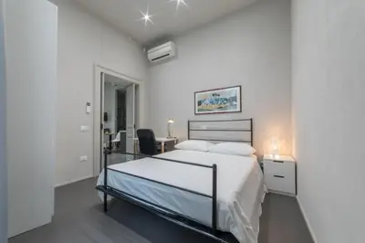 Letto o letti in una camera di Residenza Archimede
