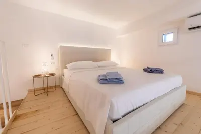 Letto o letti in una camera di Residenza Archimede