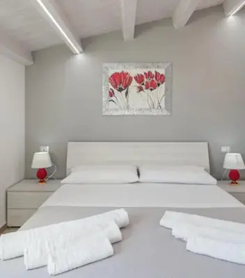 Letto o letti in una camera di LA CASA DEL CORSO
