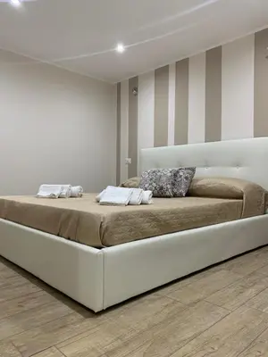 Letto o letti in una camera di Sole & Luna