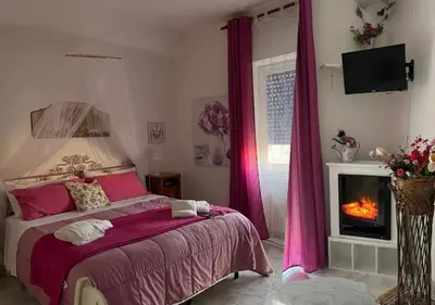 Letto o letti in una camera di Eder Home A un passo dal Teatro Greco