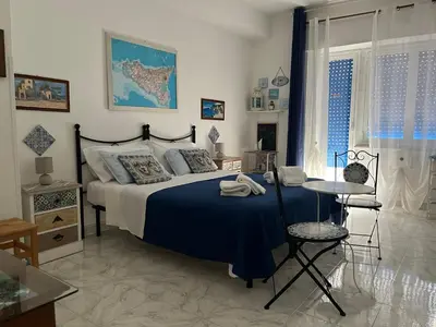 Letto o letti in una camera di Eder Home A un passo dal Teatro Greco