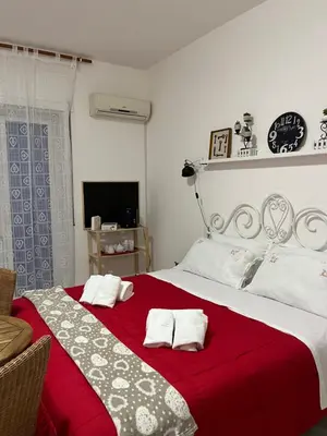 Letto o letti in una camera di Eder Home A un passo dal Teatro Greco