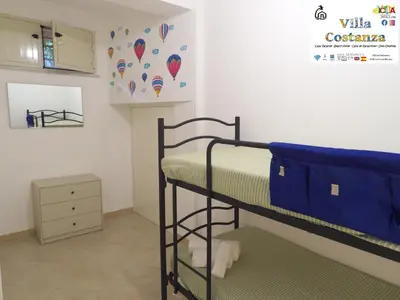 Letto o letti in una camera di Villa Costanza Casa Vacanze