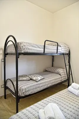Letto o letti in una camera di La Gardenia