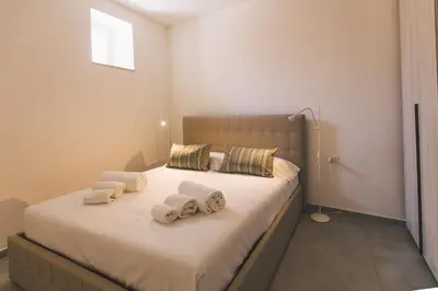 Letto o letti in una camera di Alagona Apartment