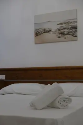 Letto o letti in una camera di Dimora Savarino Marzamemi Suites with pool