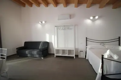 Letto o letti in una camera di Dimora Savarino Marzamemi Suites with pool